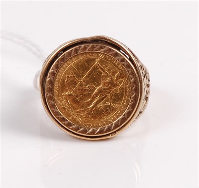 Lot 396 - A modern 9ct gold coin set ring, centre set...