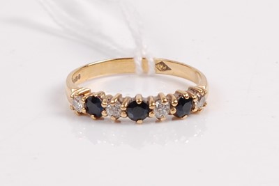 Lot 404 - A contemporary 18ct gold, sapphire and diamond...