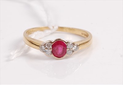 Lot 405 - An 18ct gold, ruby and diamond dress ring,...