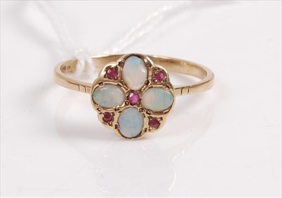 Lot 406 - A 9ct gold, ruby and opal dress ring, arranged...