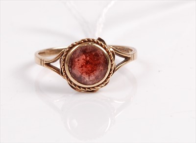 Lot 410 - A vintage 9ct gold round cut ruby set ring,...