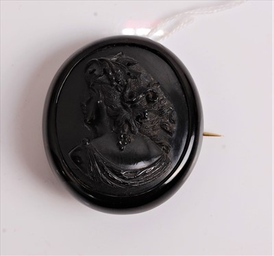 Lot 420 - A Victorian carved Whitby jet brooch depicting...