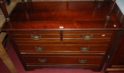 Lot 1208 - An Edwardian walnut low chest of two short...