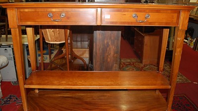 Lot 1230 - A reproduction yew wood two drawer two-tier...