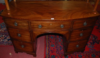 Lot 1231 - A 19th century mahogany bowfront kneehole...