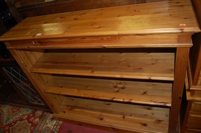 Lot 1235 - A modern pine low freestanding open bookshelf,...