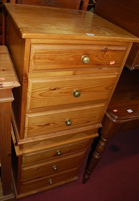 Lot 1236 - A pair of modern pine three-drawer bedside...