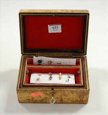 Lot 633 - A leather clad jewellery box and contents, to...