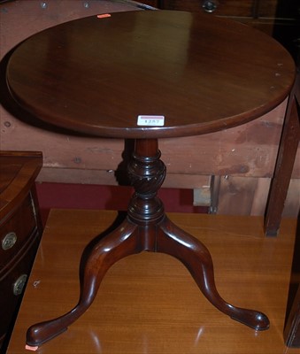 Lot 1257 - A mahogany low fixed top circular pedestal...