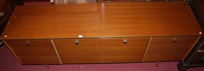 Lot 1259 - A 1970s Avalon Yatton teak long sideboard, the...