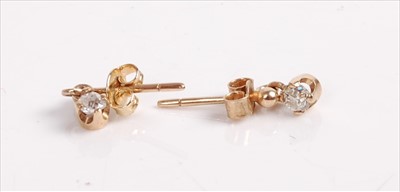 Lot 444 - A pair of yellow metal diamond ear studs, each...