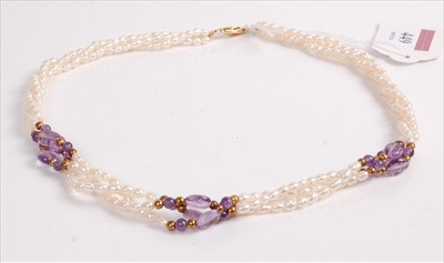 Lot 449 - A cultured seed pearl and amethyst set triple...