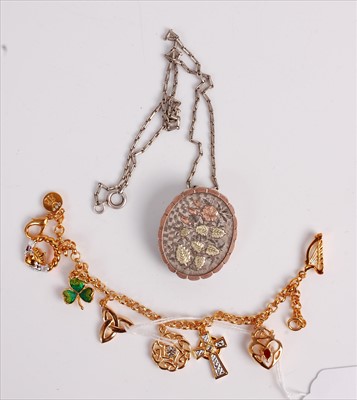 Lot 450 - A gilt metal and paste set charm bracelet, in...