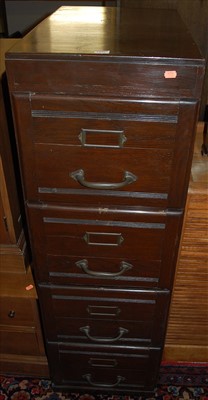 Lot 1272 - A 1930s stained oak four drawer office filing...