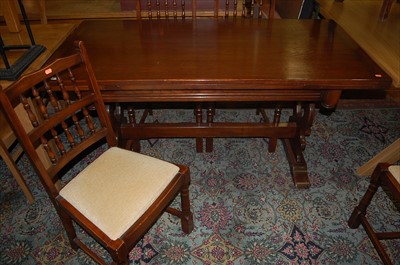 Lot 1282 - A contemporary moulded oak dining suite...