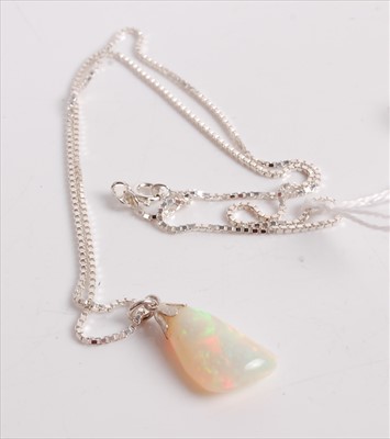 Lot 464 - A contemporary polished opal pendant, on...