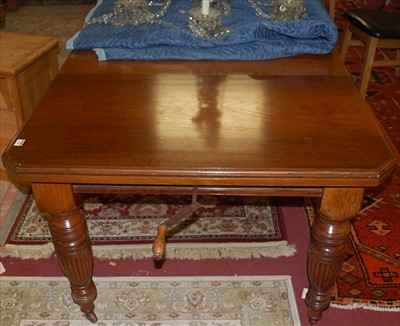 Lot 1308 - An Edwardian walnut extending dining table...