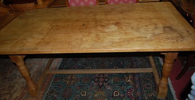 Lot 1314 - A light oak refectory dining table having...