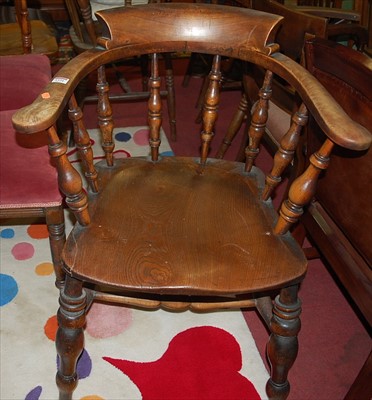 Lot 1334 - An early 20th century elm seat and beech...