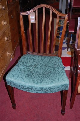 Lot 1339 - A set of four mahogany stickback dining chairs,...