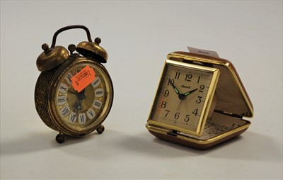 Lot 196 - An Ingersoll travel clock; together with a...