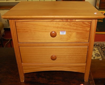 Lot 1363 - A contemporary beech two-drawer low bedside...