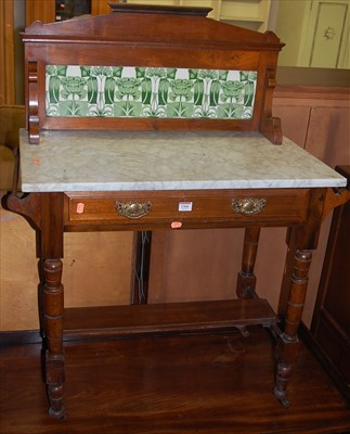 Lot 1366 - An Edwardian walnut white marble topped and...