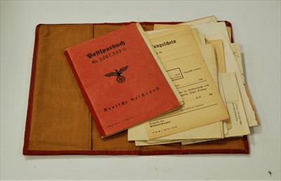 Lot 762 - A red leather clad folio containing a WWII...