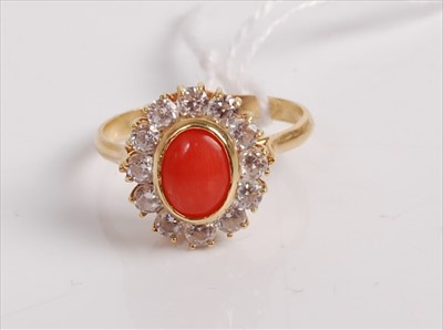 Lot 489 - An 18ct gold, coral and cz set dress ring,...