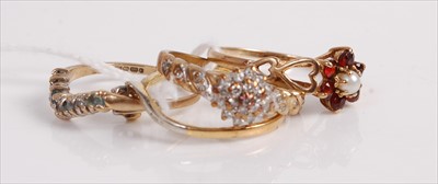 Lot 495 - A 9ct gold cz set dress ring; together with...