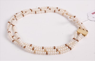 Lot 497 - A freshwater pearl triple string choker,...