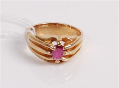 Lot 511 - A yellow metal ruby set ring, the round cut...