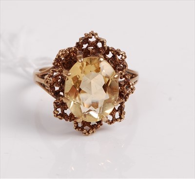 Lot 513 - A modern 9ct gold and citrine set dress ring,...