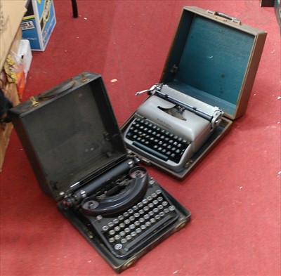 Lot 895 - A Remington travel typewriter, together with...