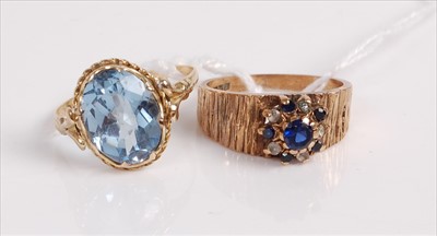 Lot 524 - A modern 9ct gold, blue and white sapphire set...