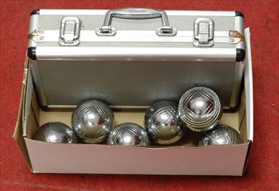 Lot 901 - A cased boules set, together with another