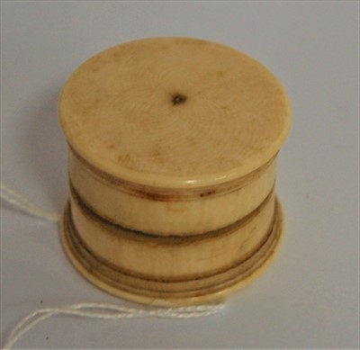 Lot 352 - A cylindrical ivory ring box, having screw cap,...