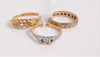 Lot 522 - A 9ct gold diamond highlight set eternity ring,...