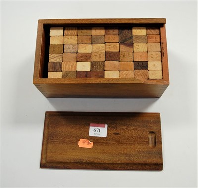 Lot 671 - A boxed African Takoradi wooden block game