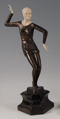 Lot 203 - An Art Deco style bronze and composite figure...