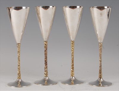 Lot 95 - A set of four silver wine goblets by Stuart...