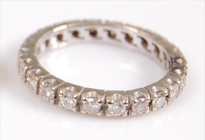 Lot 2004 - A white metal diamond full hoop eternity ring,...