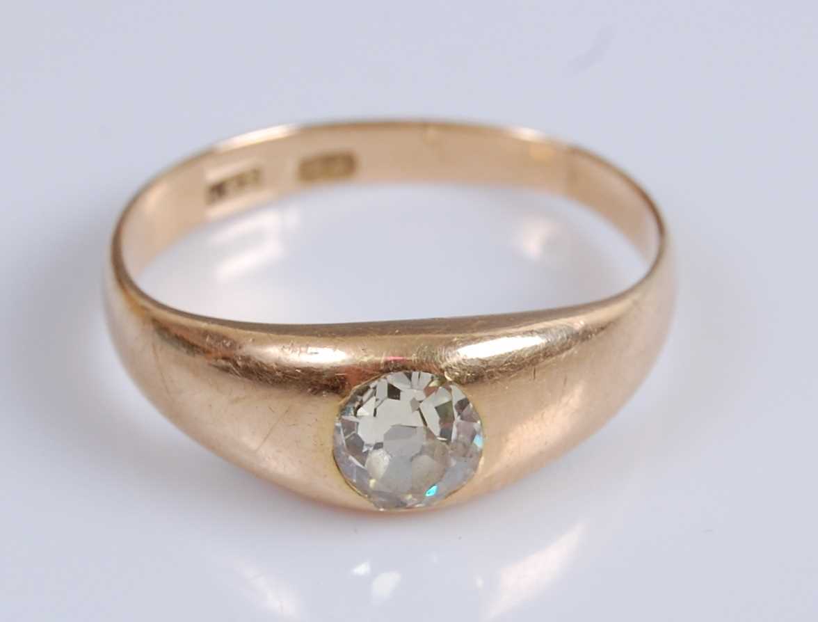 Lot 2051 - An 18ct yellow gold Gypsy set diamond ring,...