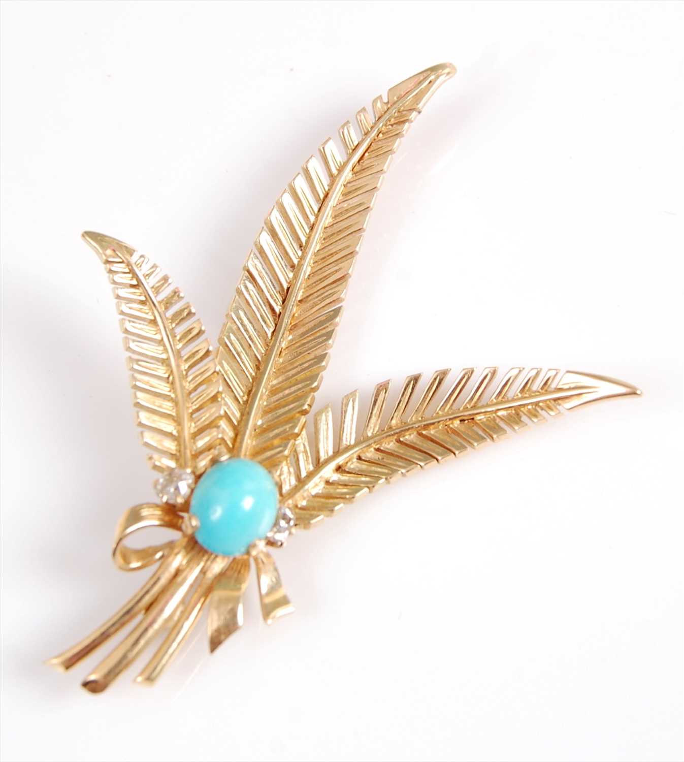 Lot 2052 - A yellow metal triple feather brooch,...