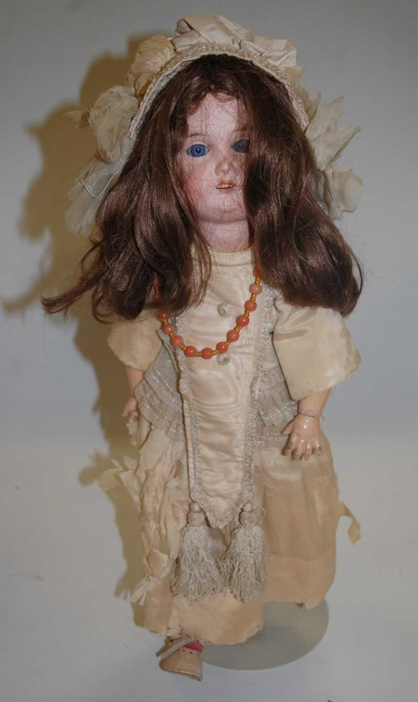 Lot 2096 - A Gebruder Kuhnlenz bisque head doll, having...