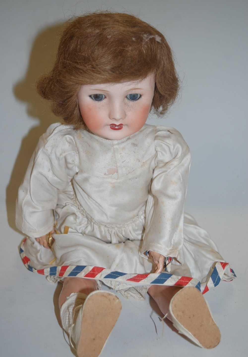 Lot 2098 - A Unis France bisque head doll, having rolling...