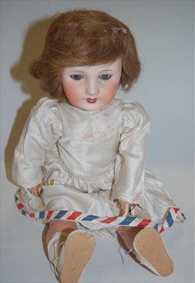 Lot 2098 - A Unis France bisque head doll, having rolling...