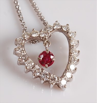 Lot 2106 - A white metal, ruby and diamond heart shaped...