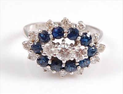 Lot 2108 - A white metal, sapphire and diamond marquise...