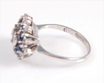 Lot 2108 - A white metal, sapphire and diamond marquise...